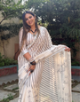 Elegant Off-White Pure Linen Digital Printed Saree with Striped Design and Unique Black Motif Pallu – Comes with Blouse Piece and Tassels