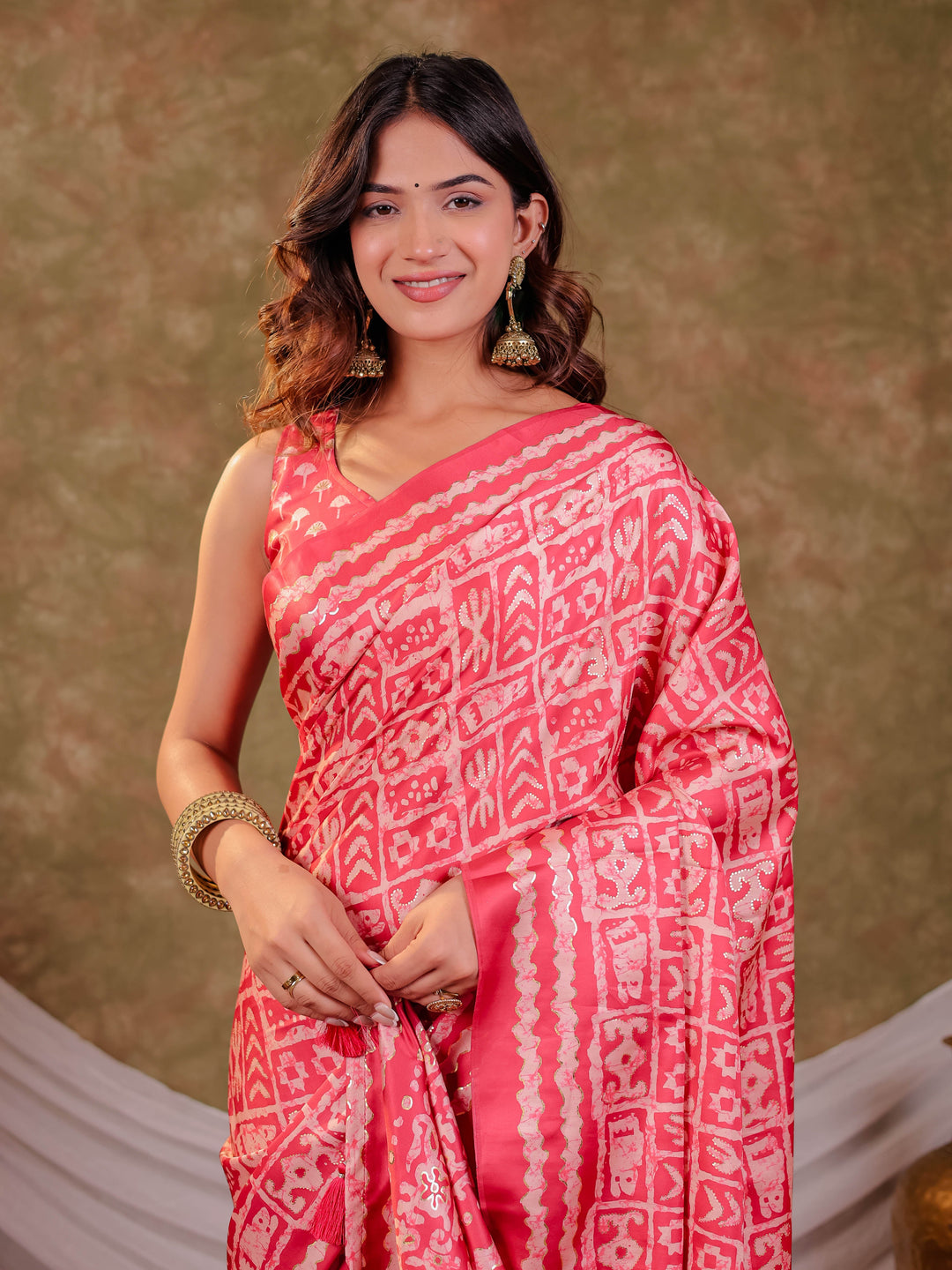 Coral Pink Pure Chinnon Batik Printed Saree with Foil Detailing, Designer Border, Tassel Edges & Matching Blouse Piece