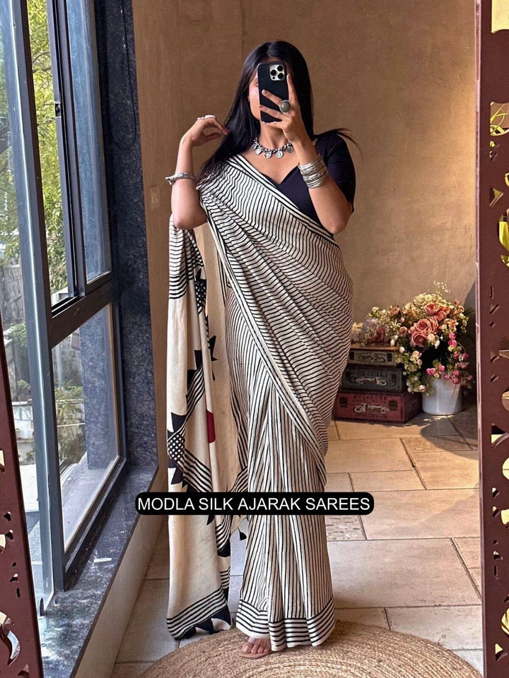 Ivory White & Black Modal Silk Contemporary Ajrakh Saree with Geometric Stripe Pattern, Artistic Statement Pallu & Tassel Detailing