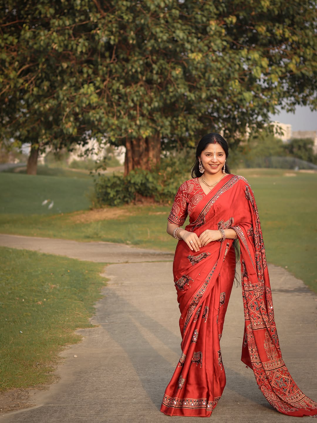 Red Modal Silk Ajrakh Printed Saree with Traditional Cow Motifs & Designer Pallu