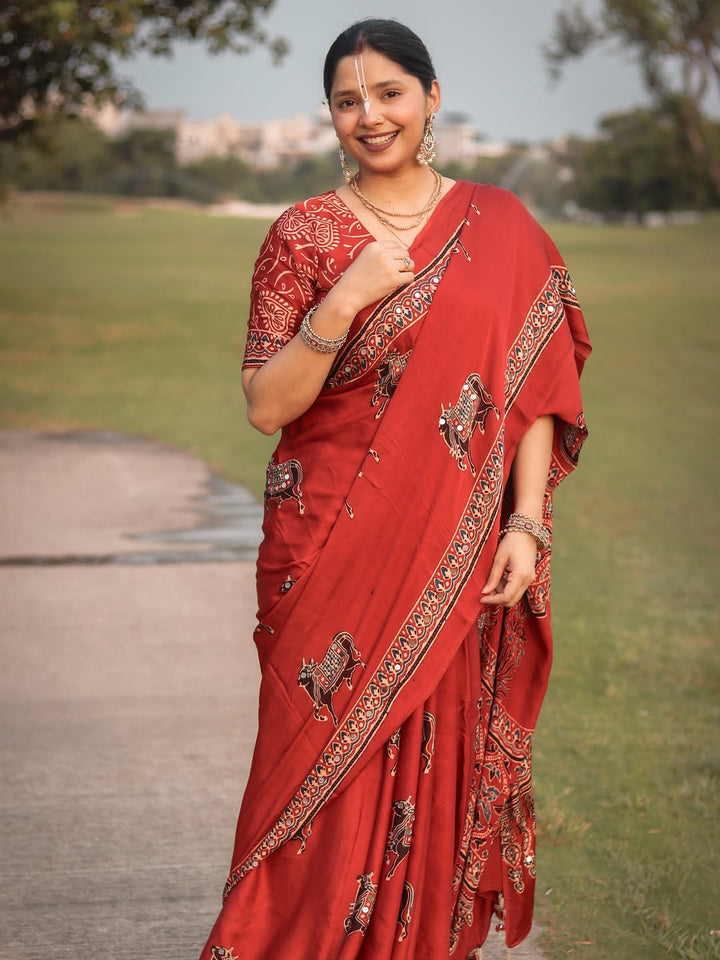 Red Modal Silk Ajrakh Printed Saree with Traditional Cow Motifs & Designer Pallu