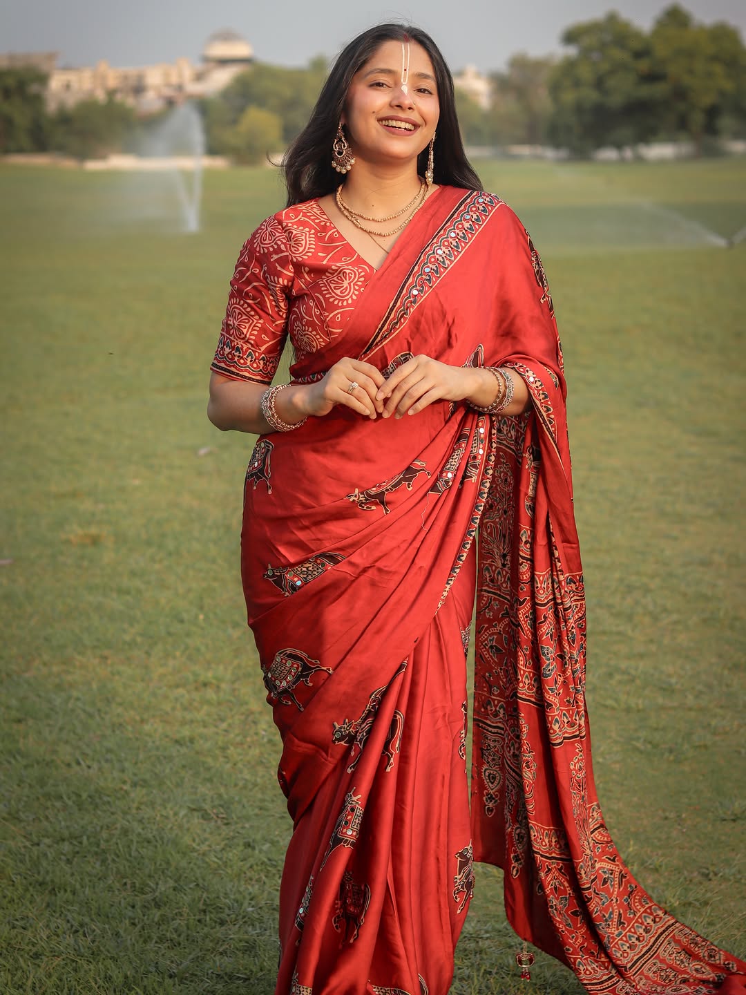 Red Modal Silk Ajrakh Printed Saree with Traditional Cow Motifs & Designer Pallu