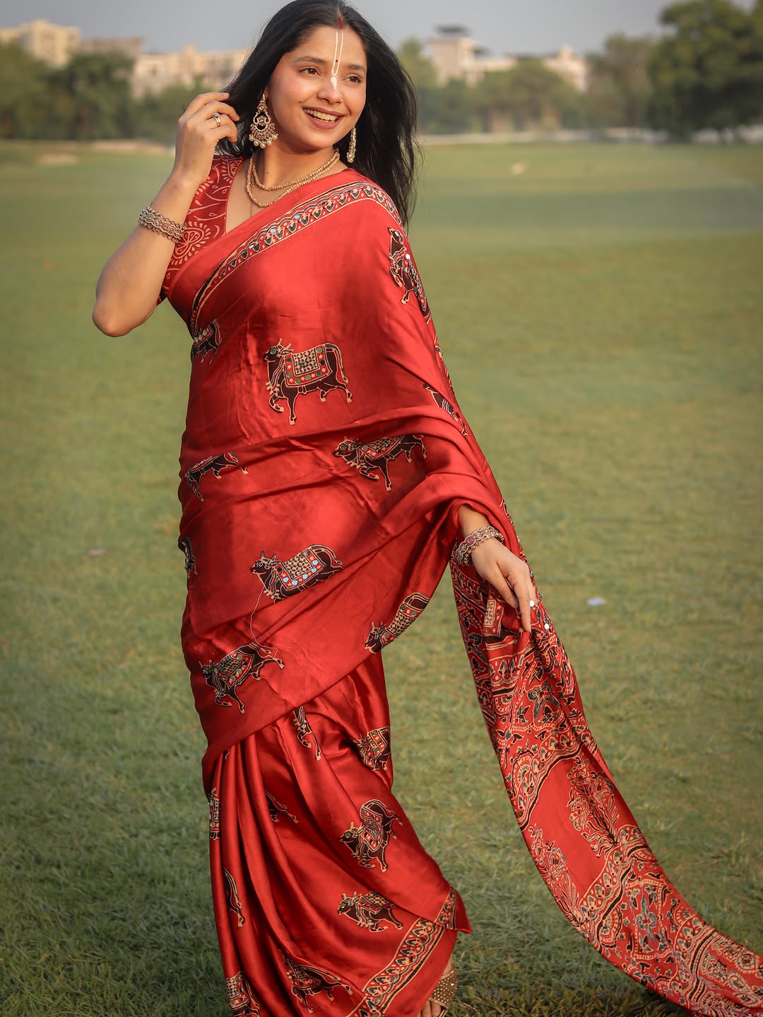 Red Modal Silk Ajrakh Printed Saree with Traditional Cow Motifs & Designer Pallu