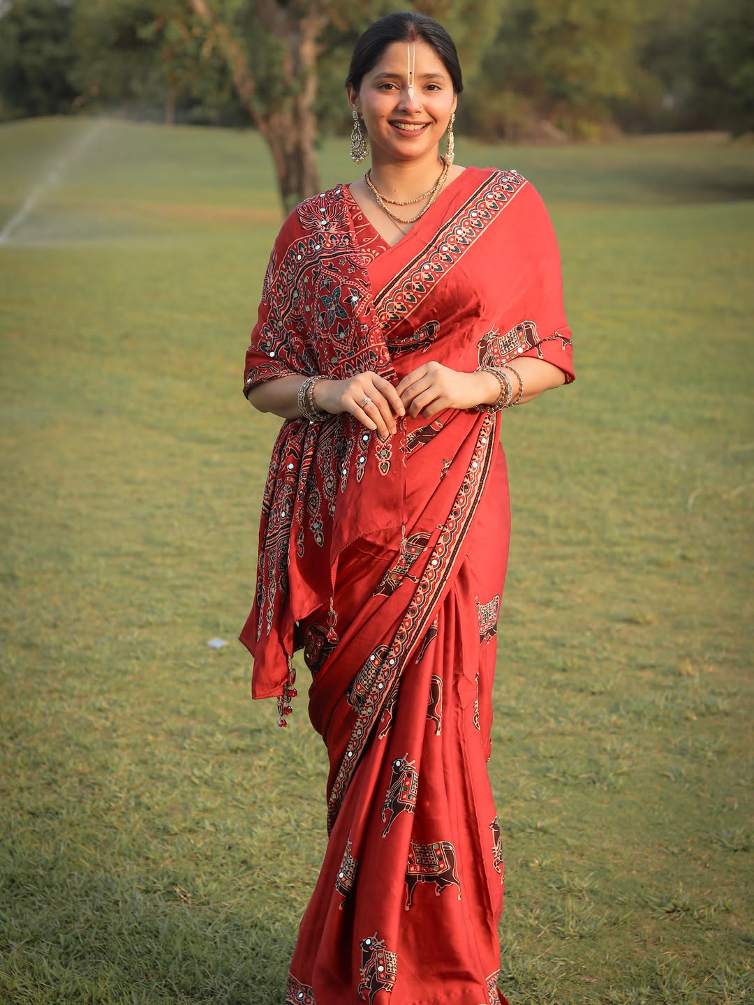 Red Modal Silk Ajrakh Printed Saree with Traditional Cow Motifs & Designer Pallu