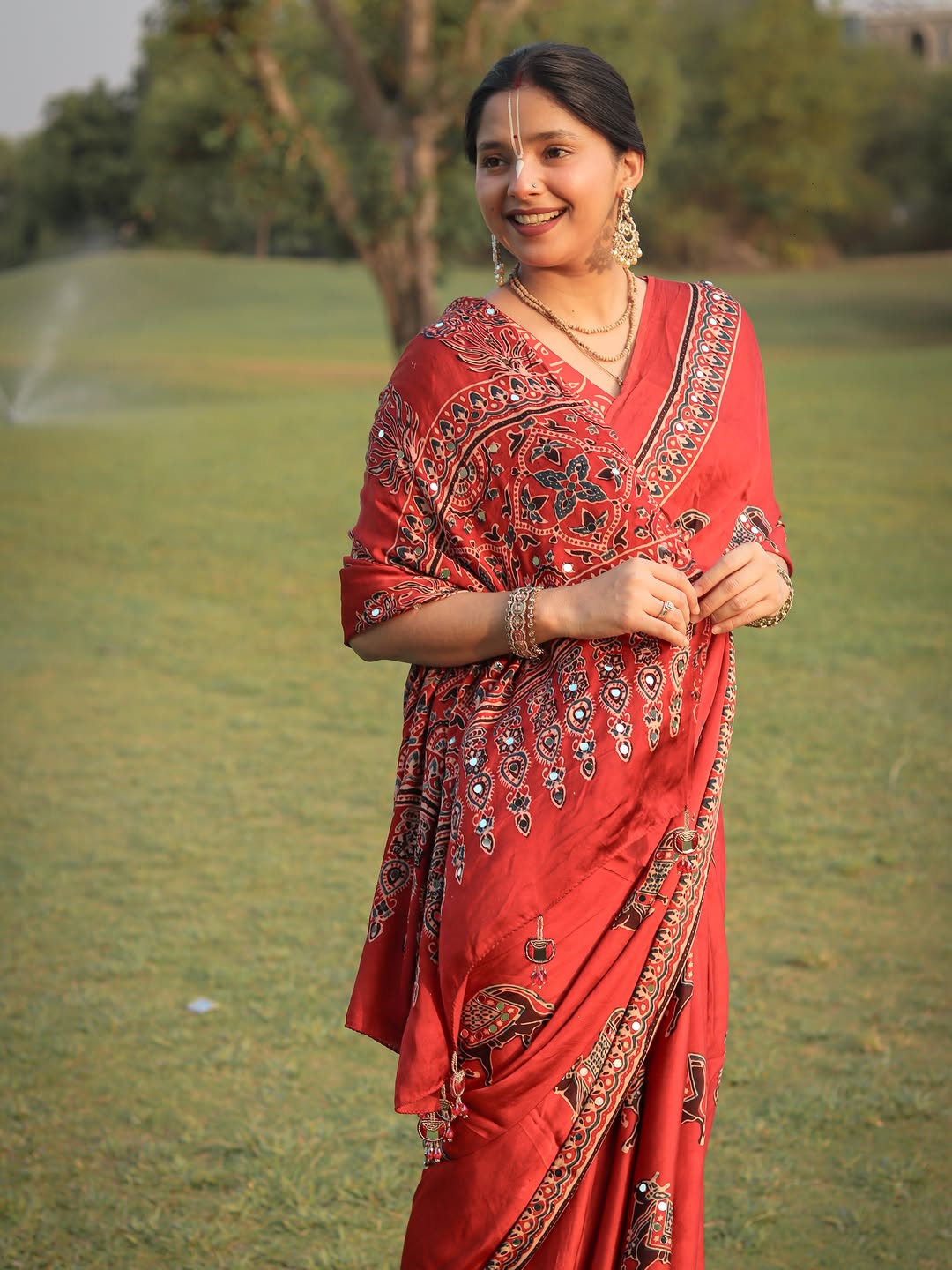 Red Modal Silk Ajrakh Printed Saree with Traditional Cow Motifs & Designer Pallu
