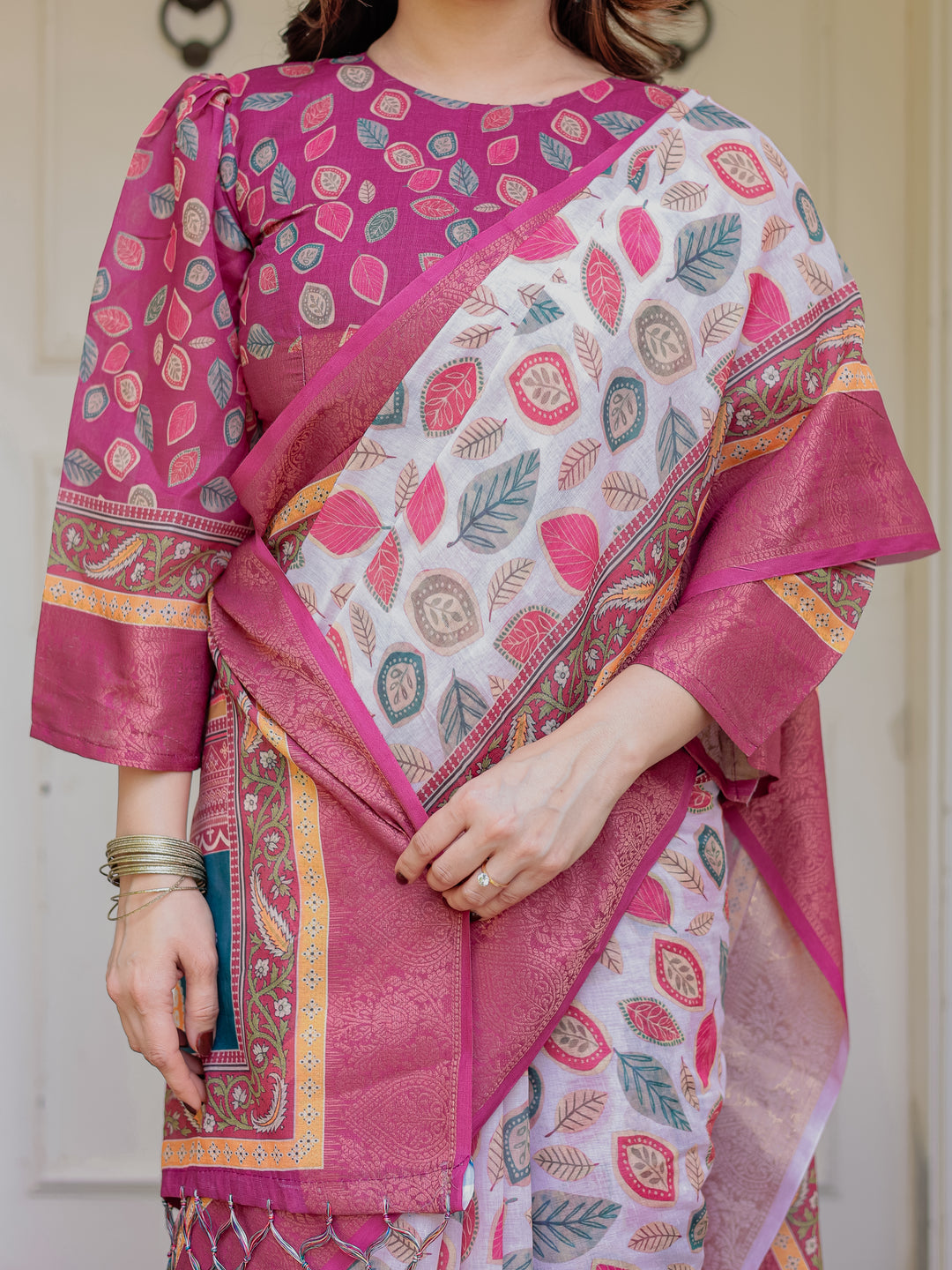 Off-White & Rani Pink Handloom Cotton Leaf Printed Saree with Zari Border & Tassels – Traditional Ethnic Wear