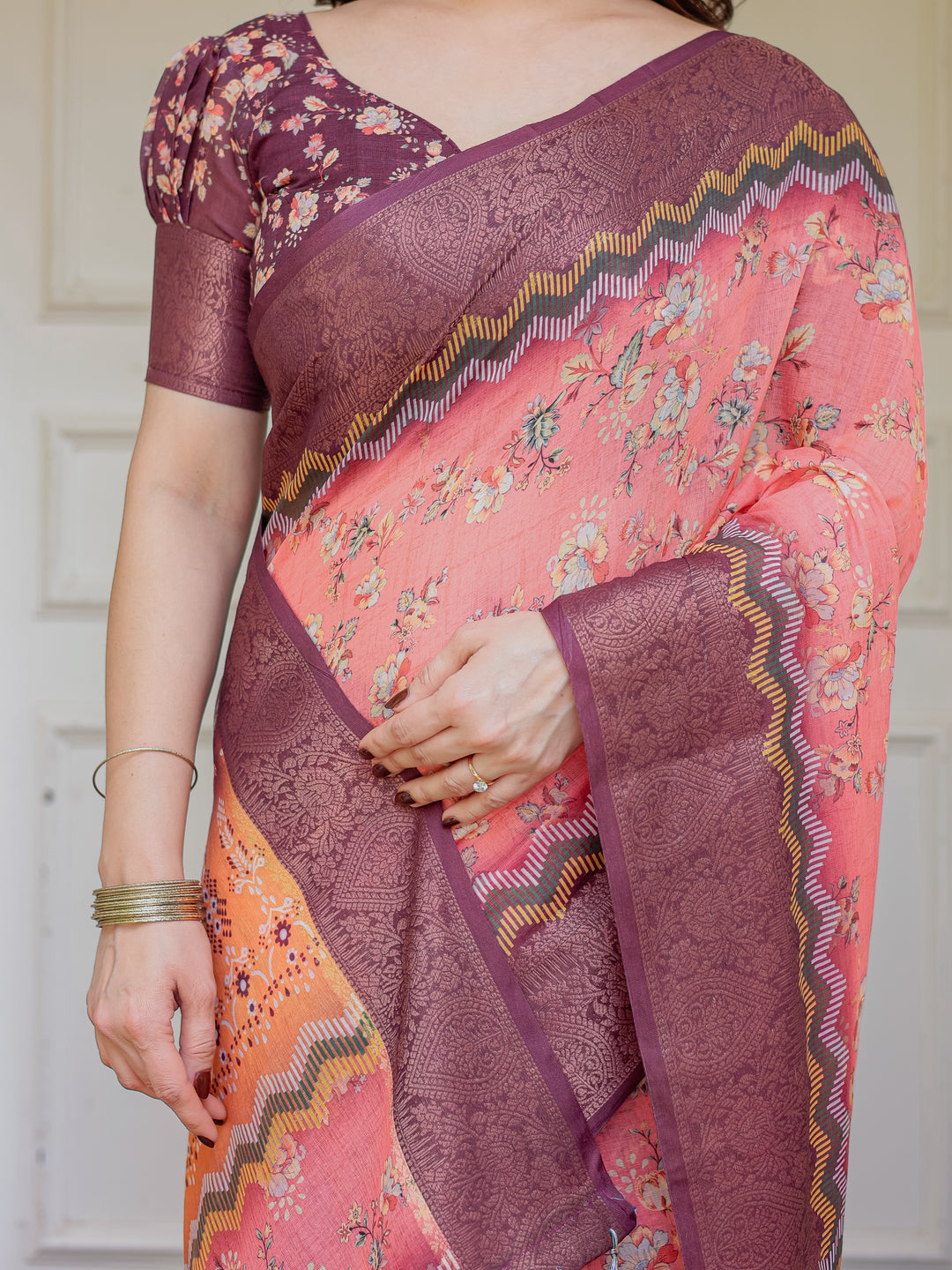 Peach Coral & Maroon Handloom Cotton Floral Printed Saree with Zari Border & Tassels – Festive Traditional Wear