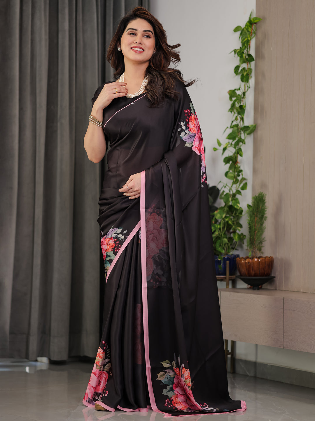 Black Satin Georgette Floral Printed Saree with Soft Pink Border & Attached Blouse – Elegant Designer Partywear Drape