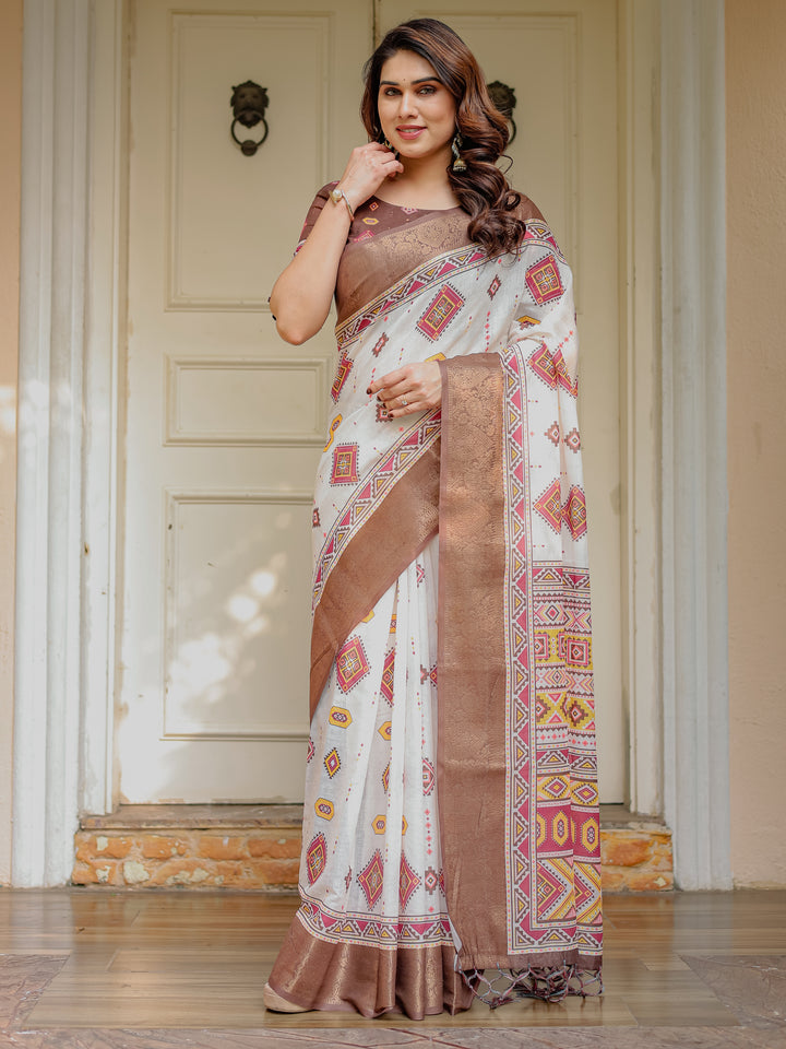 Ivory & Copper Brown Tribal Printed Saree with Rich Zari Border & Tassels – Ethnic Festive Wear
