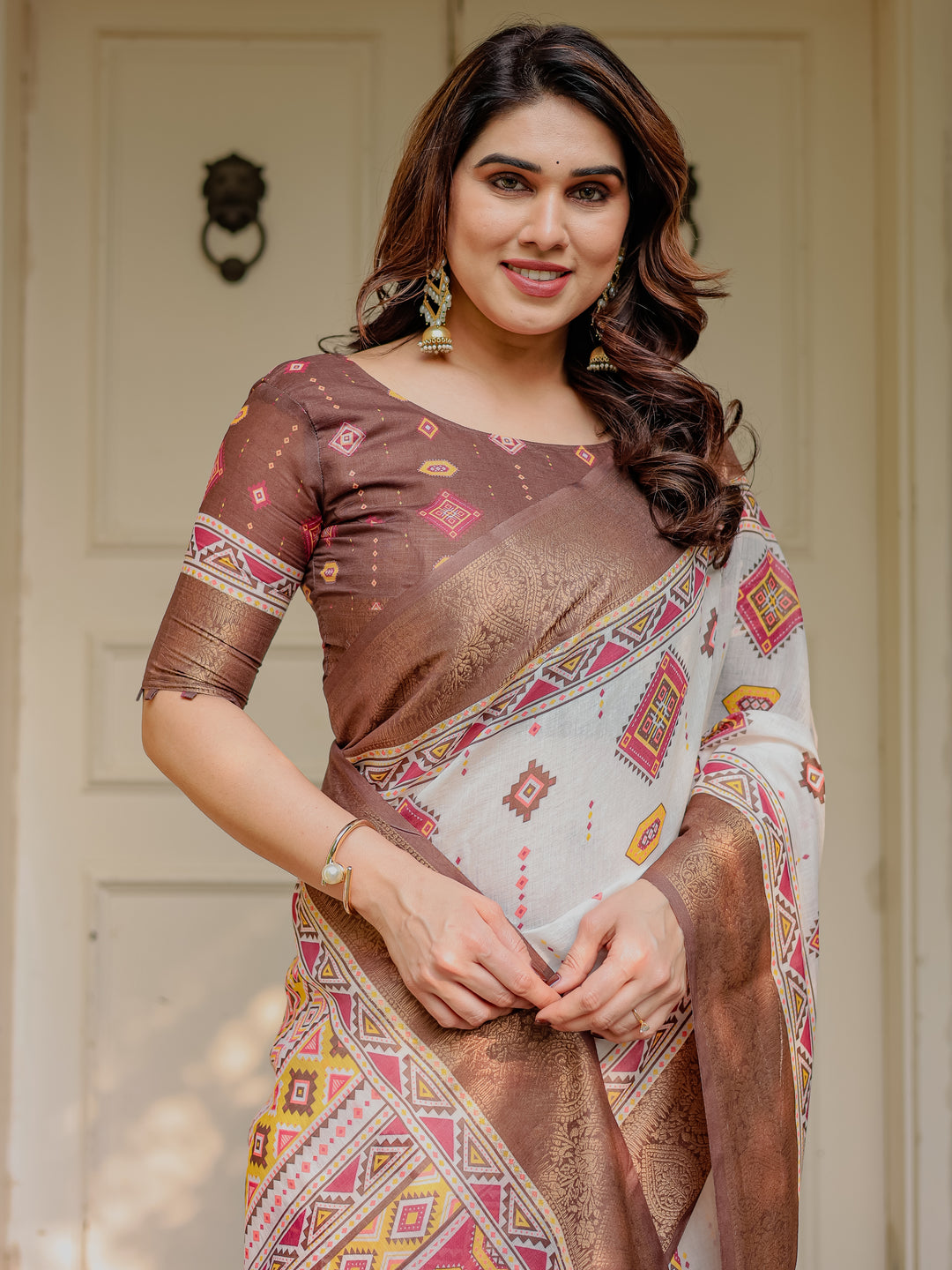 Ivory & Copper Brown Tribal Printed Saree with Rich Zari Border & Tassels – Ethnic Festive Wear