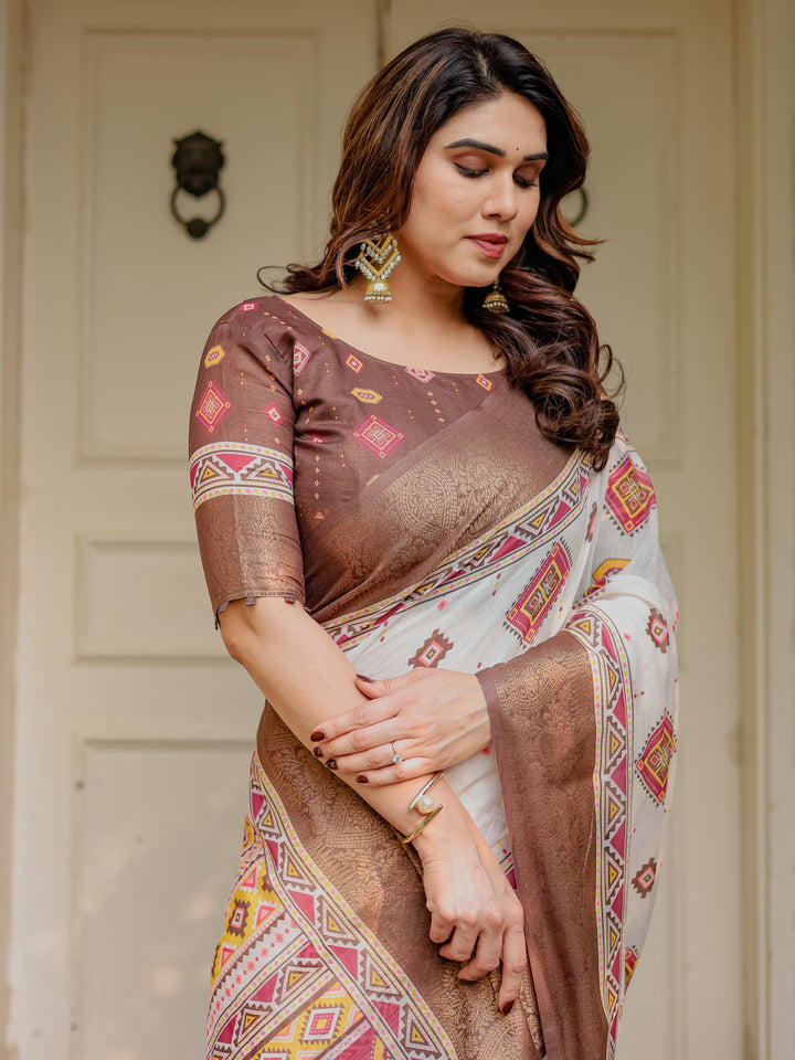 Ivory & Copper Brown Tribal Printed Saree with Rich Zari Border & Tassels – Ethnic Festive Wear