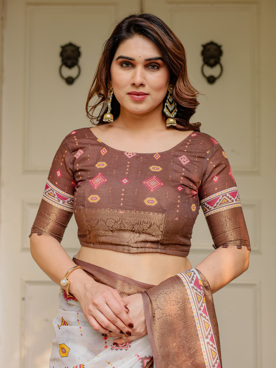 Ivory & Copper Brown Tribal Printed Saree with Rich Zari Border & Tassels – Ethnic Festive Wear