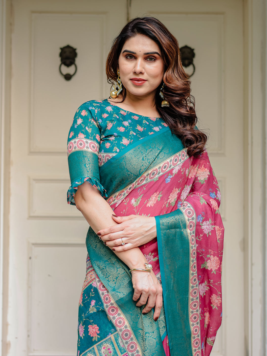 Rani Pink & Teal Green Floral Printed Saree with Rich Zari Border & Tassels – Festive Traditional Wear