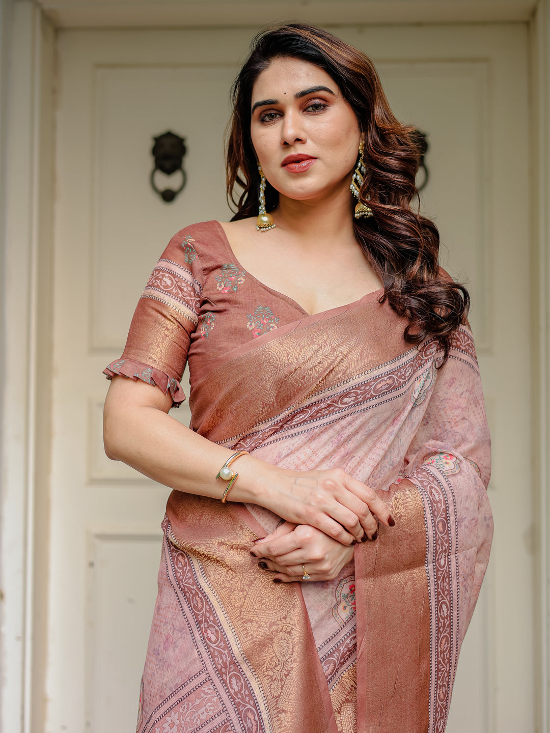 Dusty Peach & Copper Zari Woven Saree with Pastel Motifs & Tassels – Elegant Festive Traditional Wear