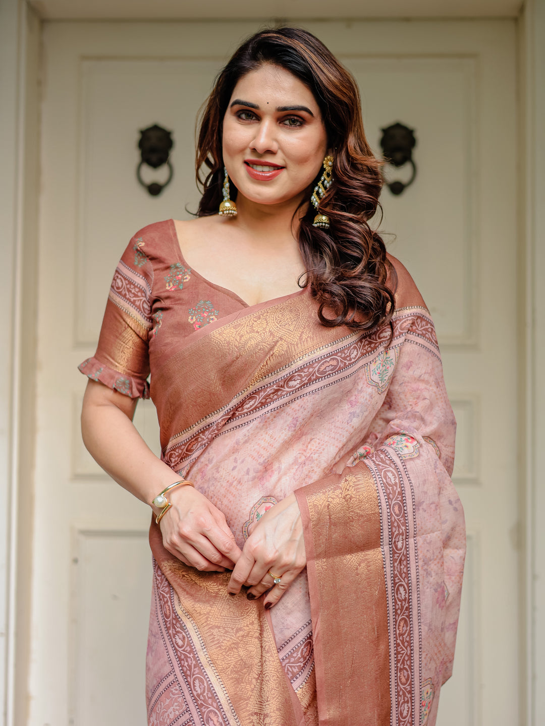 Dusty Peach & Copper Zari Woven Saree with Pastel Motifs & Tassels – Elegant Festive Traditional Wear