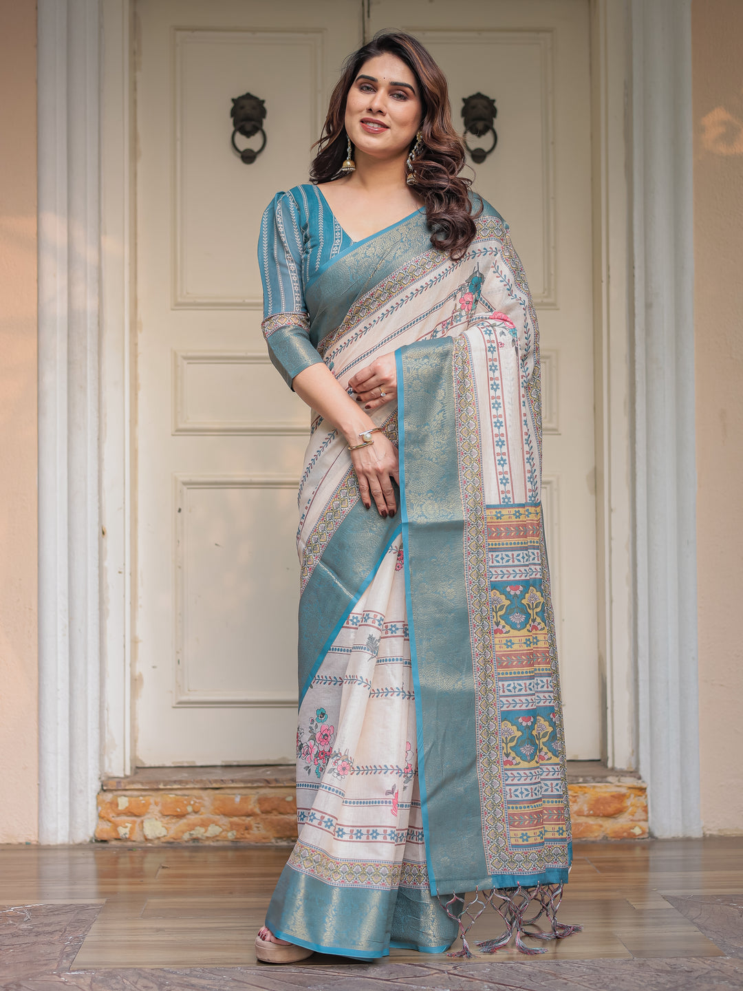 Off-White & Aqua Teal Traditional Printed Saree with Rich Zari Border & Tassels – Elegant Ethnic Festive Wear
