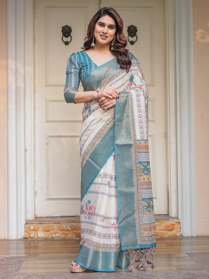 Off-White & Aqua Teal Traditional Printed Saree with Rich Zari Border & Tassels – Elegant Ethnic Festive Wear