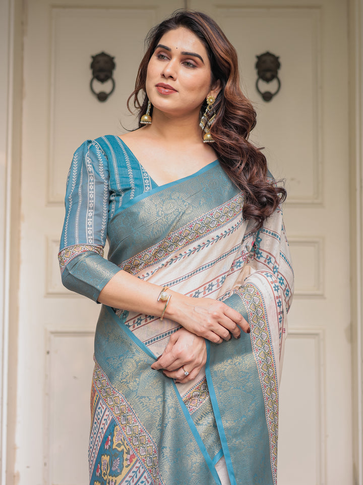 Off-White & Aqua Teal Traditional Printed Saree with Rich Zari Border & Tassels – Elegant Ethnic Festive Wear