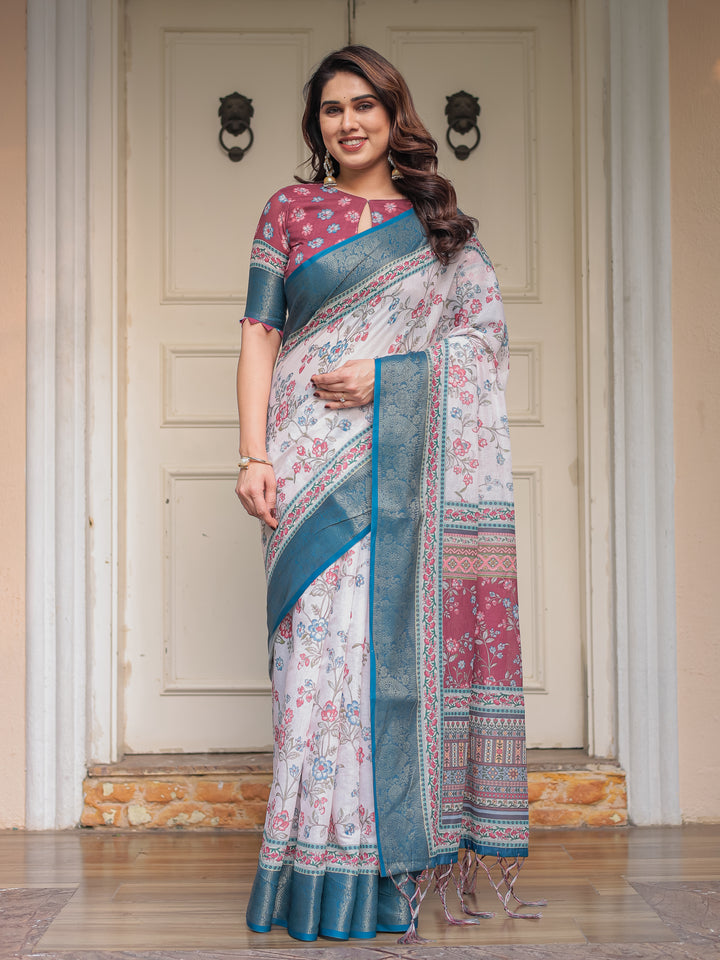 Ivory Floral Printed Saree with Rose Pink & Teal Blue Zari Border & Tassels – Elegant Festive Ethnic Wear