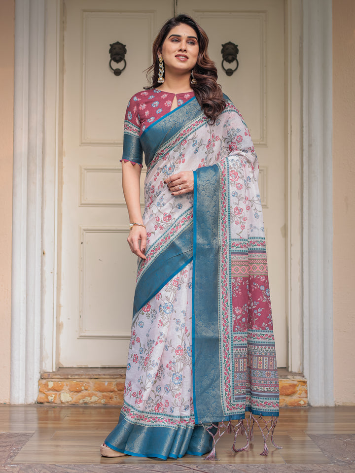 Ivory Floral Printed Saree with Rose Pink & Teal Blue Zari Border & Tassels – Elegant Festive Ethnic Wear