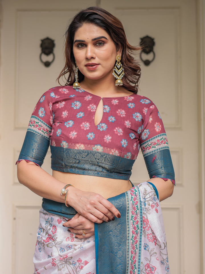 Ivory Floral Printed Saree with Rose Pink & Teal Blue Zari Border & Tassels – Elegant Festive Ethnic Wear