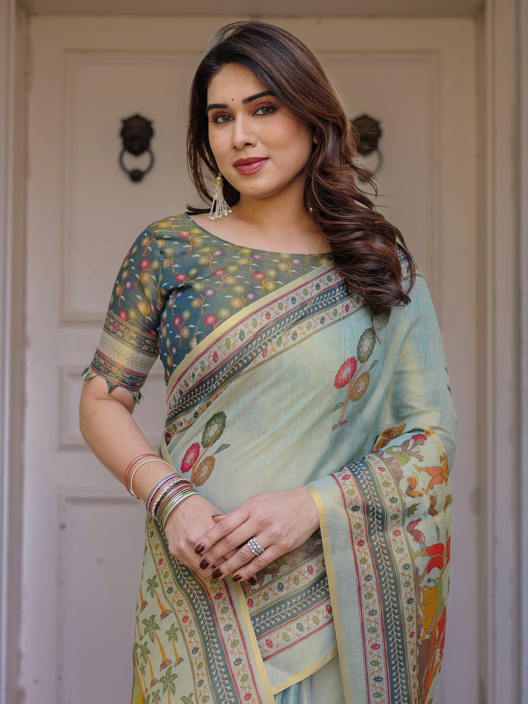 Mint Green Folk Printed Handloom Cotton Saree with Village Scene Panel Pallu, Ornamental Border & Tassels – Traditional Ethnic Wear