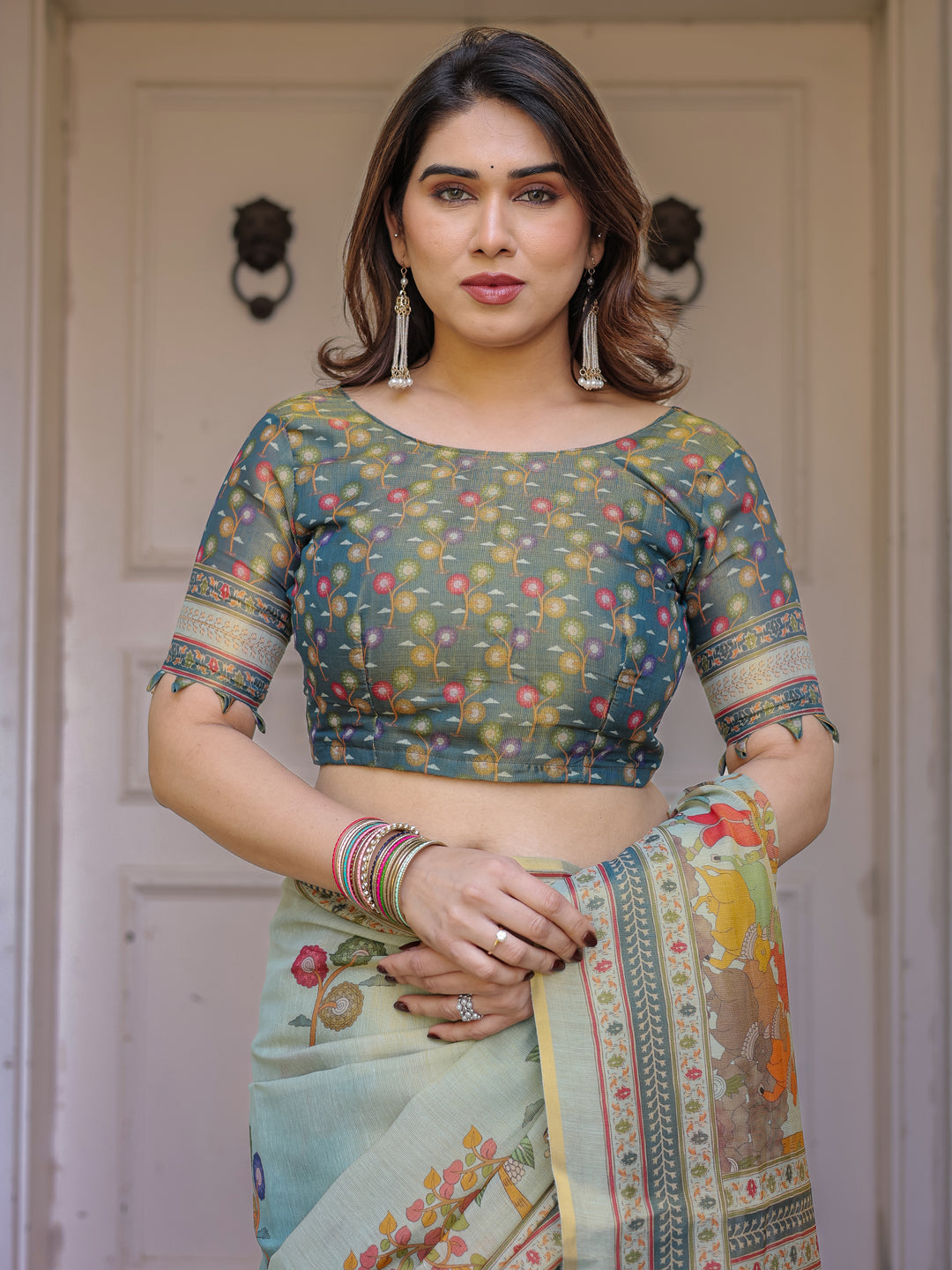 Mint Green Folk Printed Handloom Cotton Saree with Village Scene Panel Pallu, Ornamental Border & Tassels – Traditional Ethnic Wear