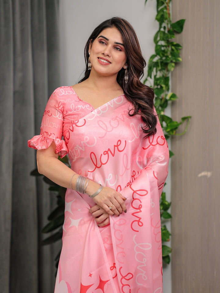 Blush Pink Satin Georgette Saree with All-Over Love Typography Print and Attached Matching Printed Blouse – 5.5 Meter Romantic Designer Saree for Valentine’s Day & Anniversary Wear
