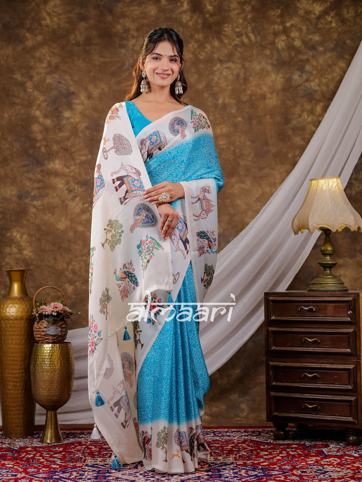 Vantara Turquoise Blue Satin Chiffon Printed Saree with Elephant & Peacock Heritage Print, Designer Tassel Pallu & Matching Blouse Piece