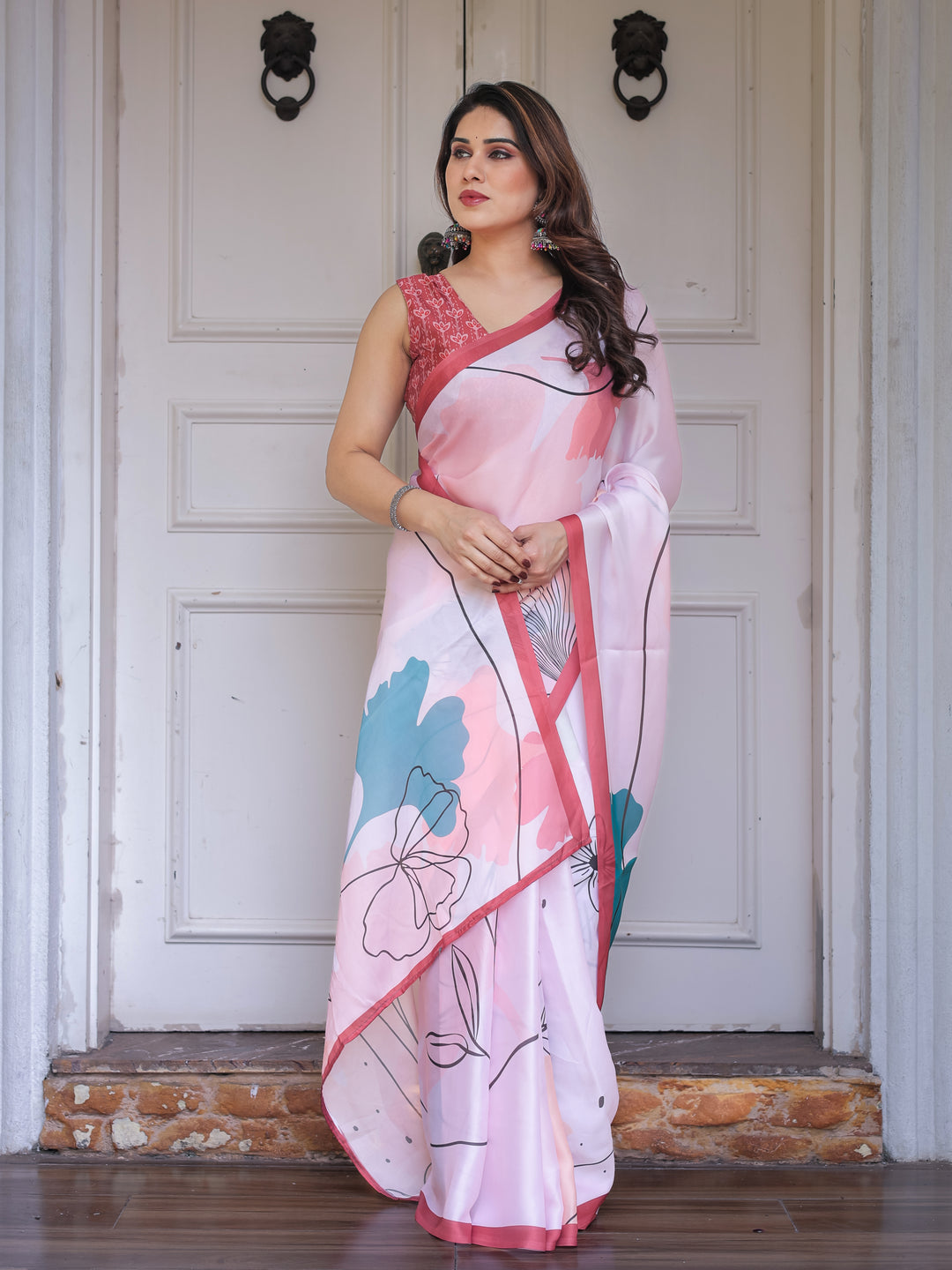 Pastel Pink Abstract Floral Printed Satin Georgette Saree with Contrast Coral Border & Matching Blouse – Modern Elegant Wear