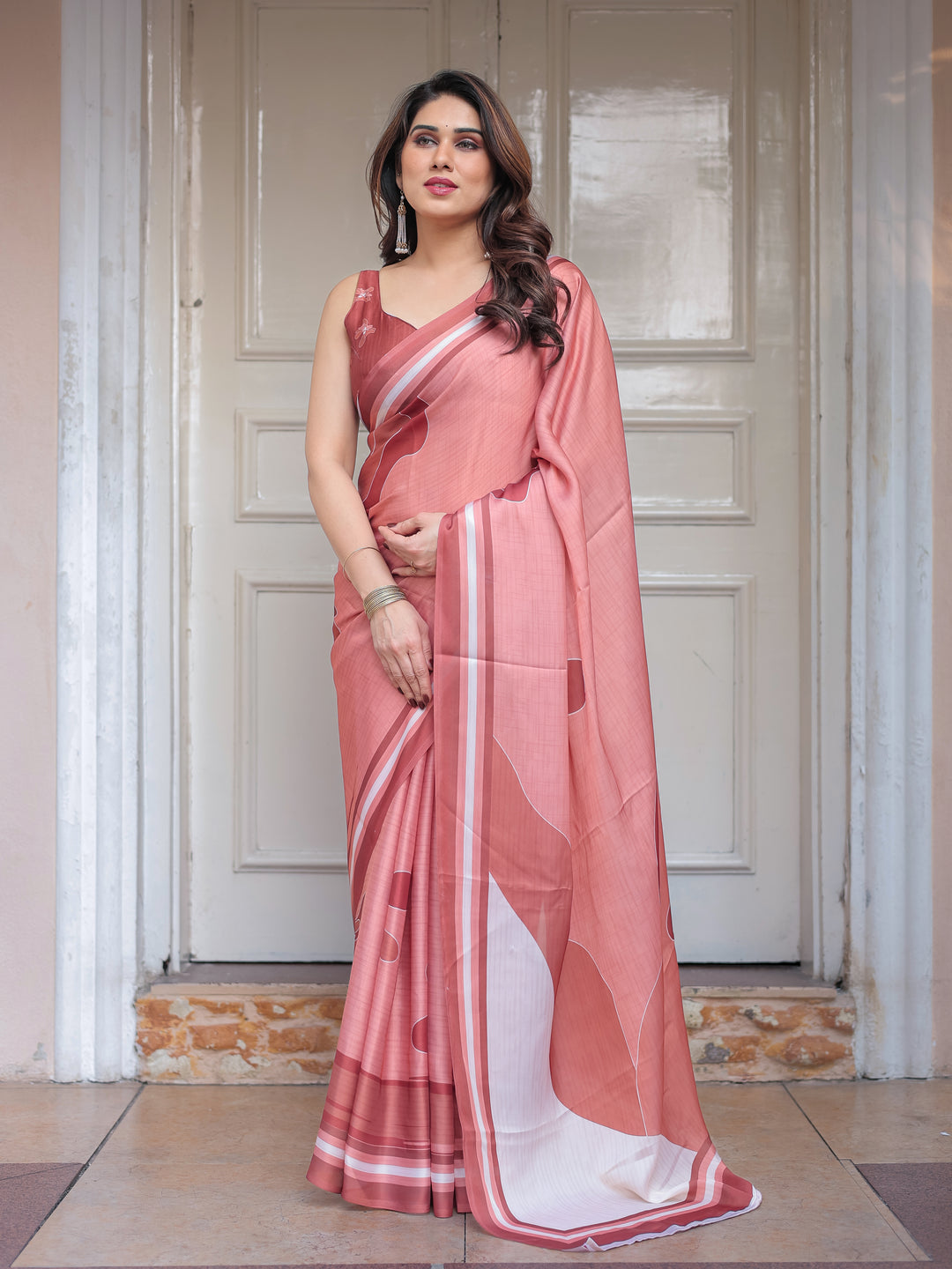 Coral Peach Minimal Floral Satin Georgette Saree with Soft Border & Unstitched Blouse – Elegant Day & Occasion Wear