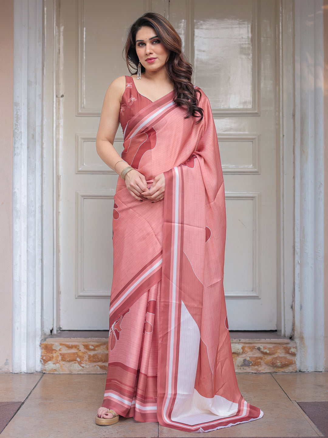 Coral Peach Minimal Floral Satin Georgette Saree with Soft Border & Unstitched Blouse – Elegant Day & Occasion Wear
