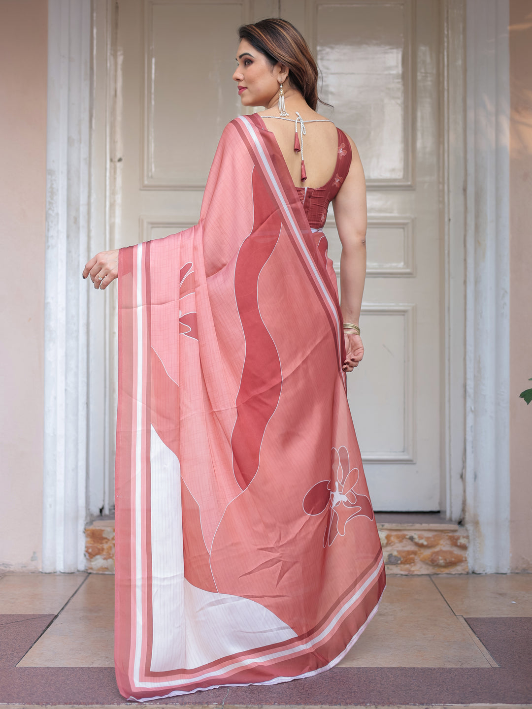 Coral Peach Minimal Floral Satin Georgette Saree with Soft Border & Unstitched Blouse – Elegant Day & Occasion Wear