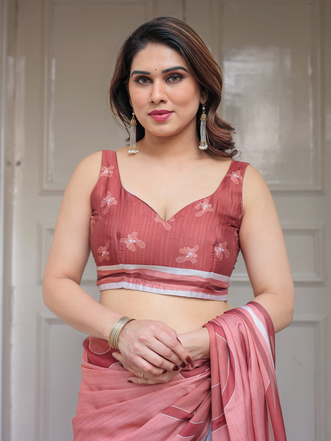 Coral Peach Minimal Floral Satin Georgette Saree with Soft Border & Unstitched Blouse – Elegant Day & Occasion Wear