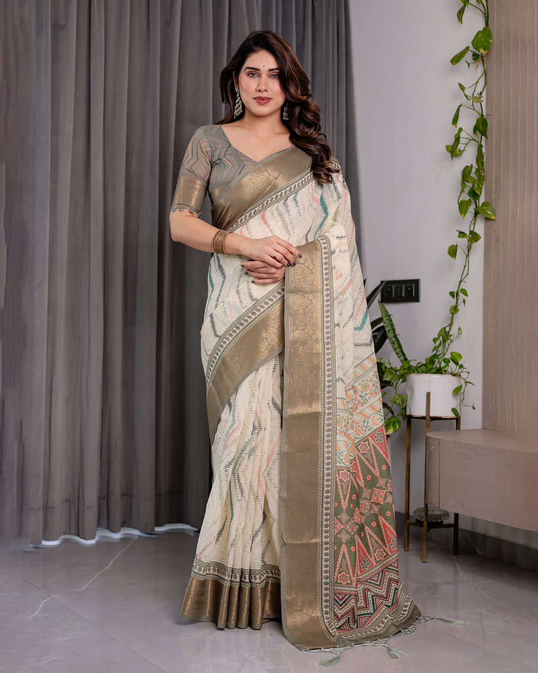 Elegant Cream & Gold Woven Ikat Silk Saree with Designer Border With Tassles
