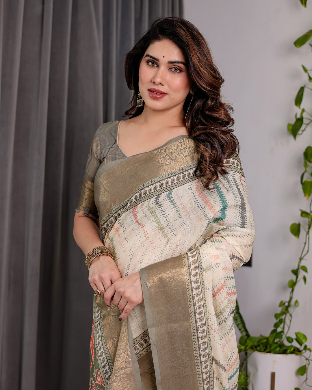 Elegant Cream & Gold Woven Ikat Silk Saree with Designer Border With Tassles