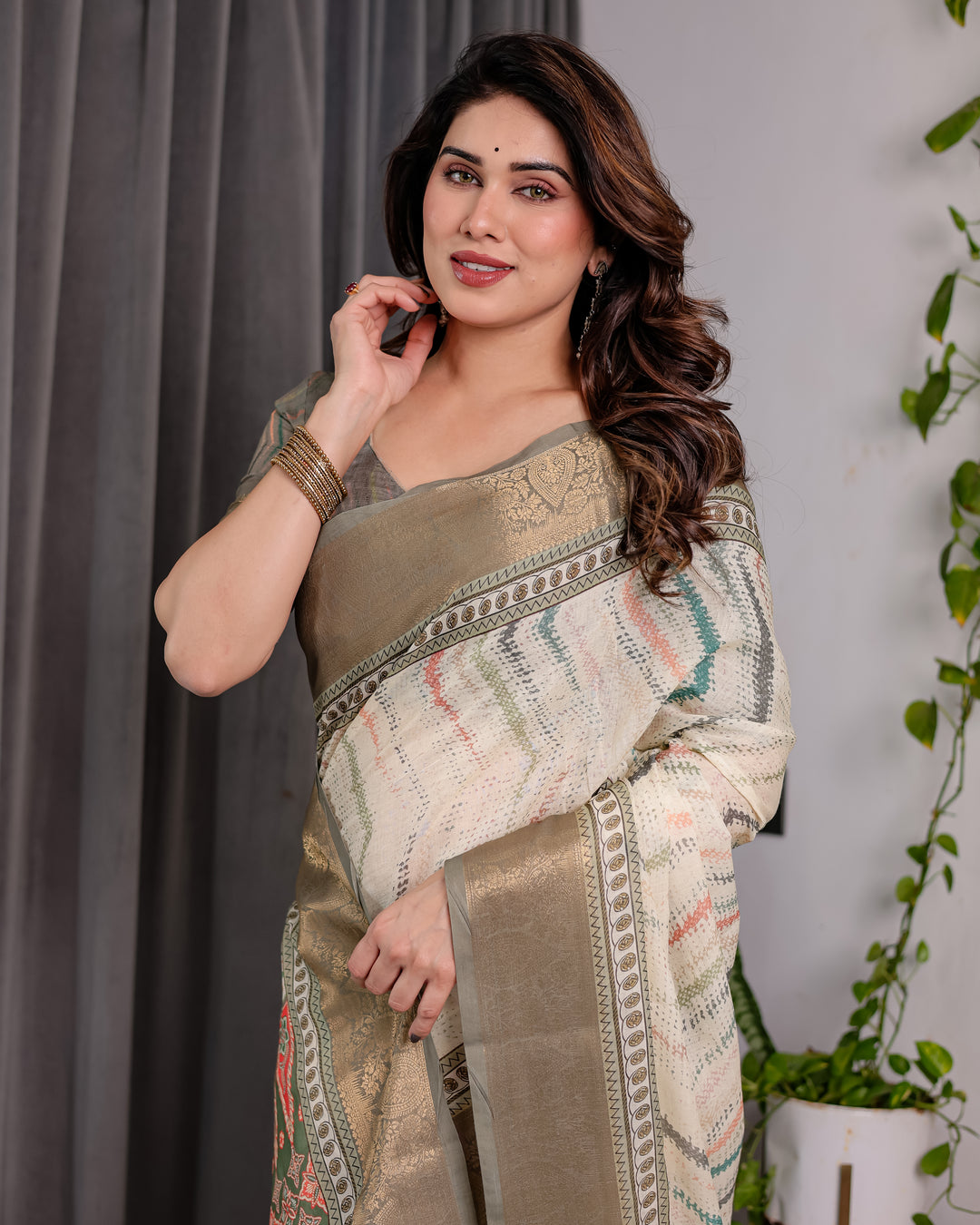 Elegant Cream & Gold Woven Ikat Silk Saree with Designer Border With Tassles