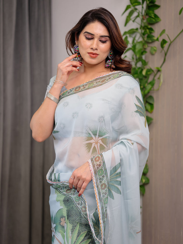 Pastel Mint Green Printed Organza Saree with Tropical Leaf Motifs | Designer Lightweight Sheer Organza Saree with Attached Blouse Piece | Elegant Festive & Day Party Saree