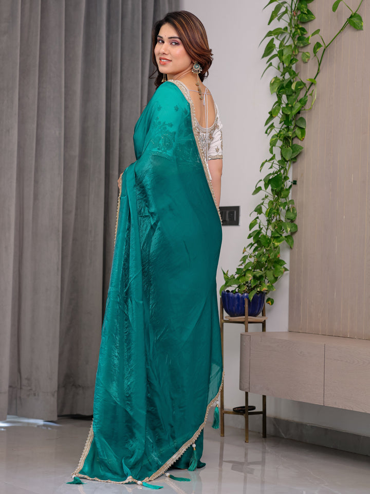 Emerald Green Fendy Satin Saree with Pearl Lace Border & Tassel Pallu | Premium Shimmer Satin Saree with Heavy Embroidered Designer Blouse | Zari Floral & Peacock Embroidery Blouse Festive Saree