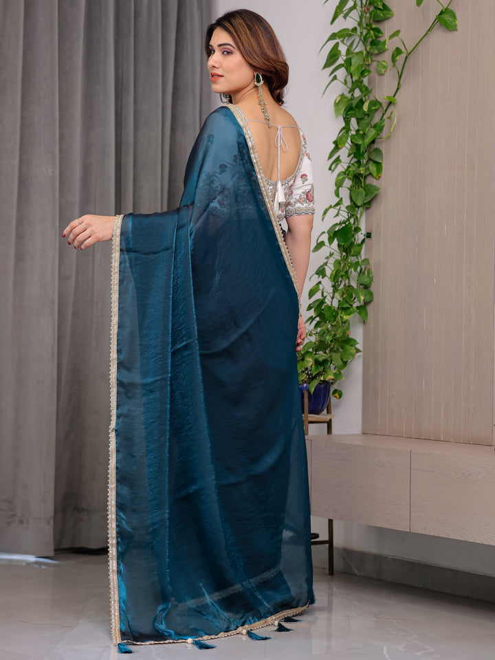 Deep Teal Fendy Satin Designer Saree with Pearl Lace Border & Tassel Pallu | Premium Shimmer Satin Saree with Heavy Floral Embroidered Ivory Blouse | Wedding & Festive Wear Saree