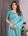 Turquoise Blue Handloom Linen Saree with Floral Digital Print & Golden Zari Border | Tassel Detailing | Attached Blouse | 5.5m Saree + 0.8m Blouse