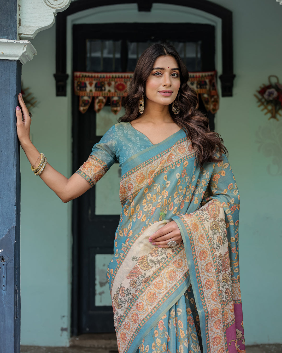 Turquoise Blue Handloom Cotton Saree with Multicolor Floral Pallu & Peach Border