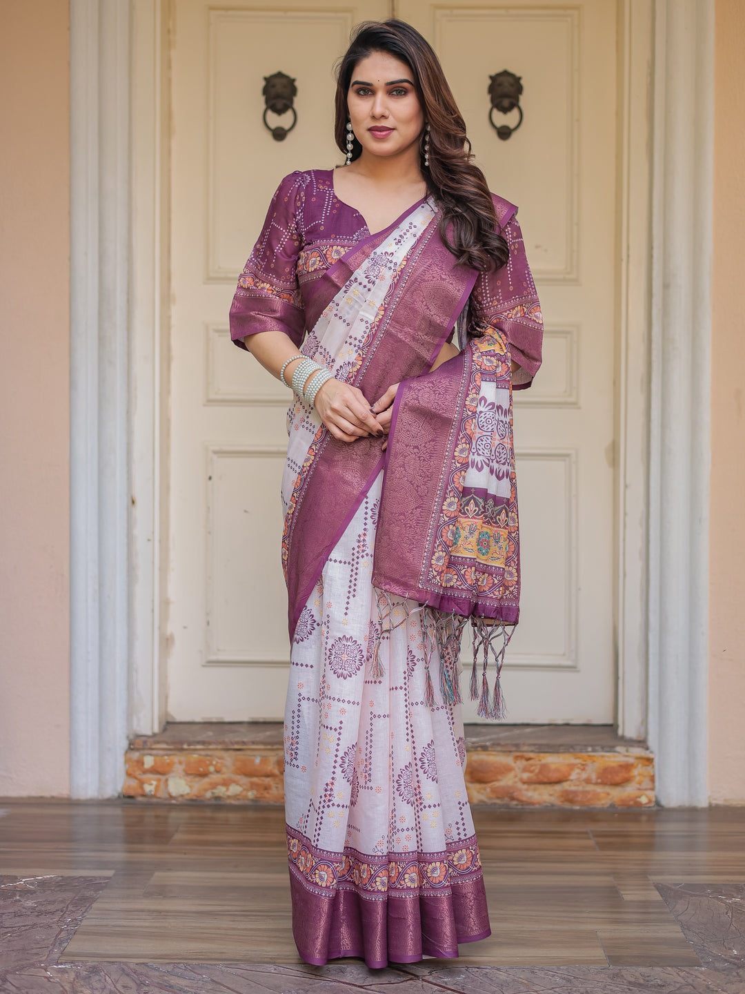 Wine Purple Handloom Cotton Printed Saree with Floral Panel Pallu, Ornamental Border & Tassels – Festive Ethnic Wear