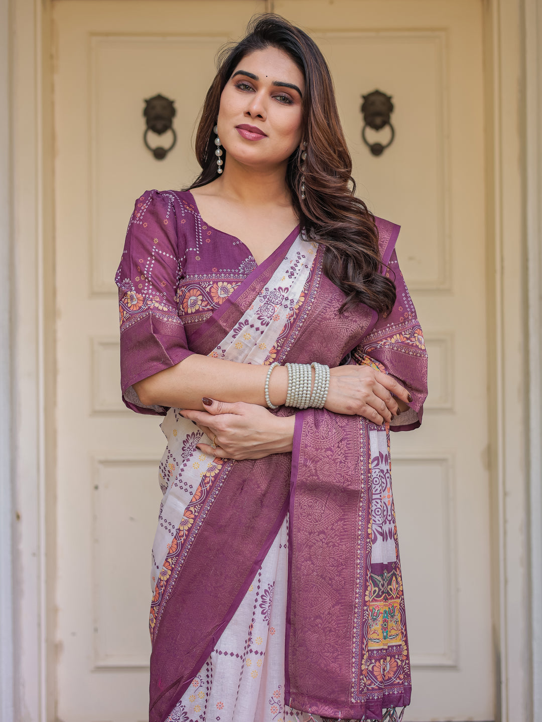 Wine Purple Handloom Cotton Printed Saree with Floral Panel Pallu, Ornamental Border & Tassels – Festive Ethnic Wear